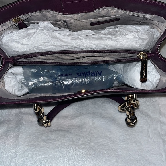 Brand new dark purple Michael Kors purse! Buttons at the top. Divides in center - Picture 3 of 6